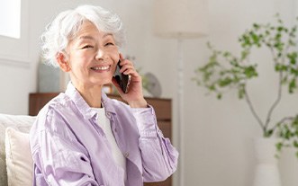Woman smiling while talking on the phone