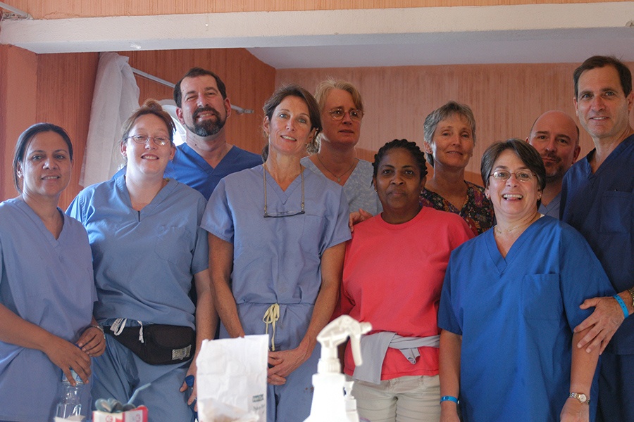 Group of dentists and dental team members smiling together