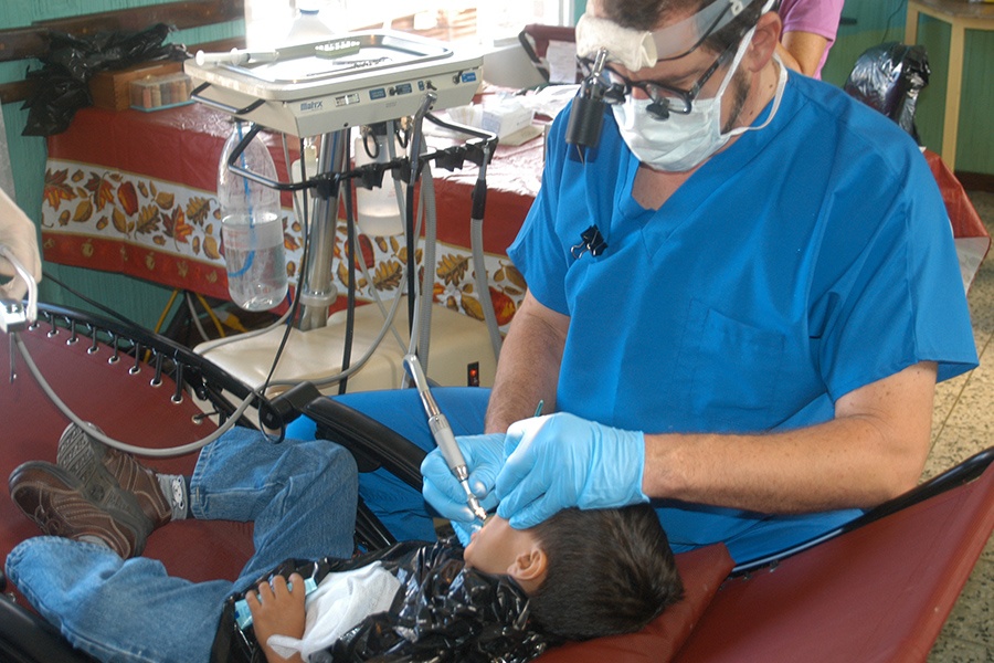 Dentist treating young dental patient