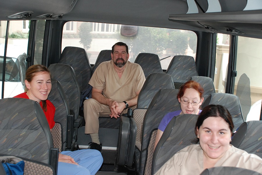 Dentist and team members on a bus