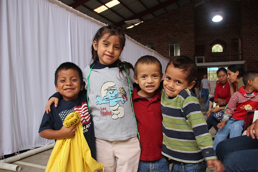 Four smiling young dental patients