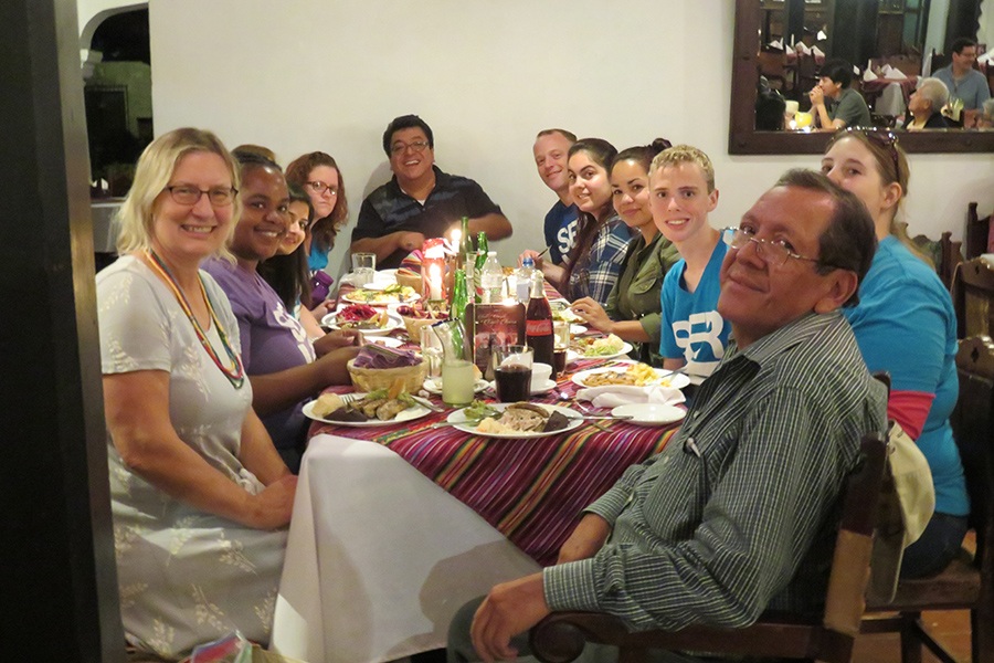 Group of team members eating dinner together