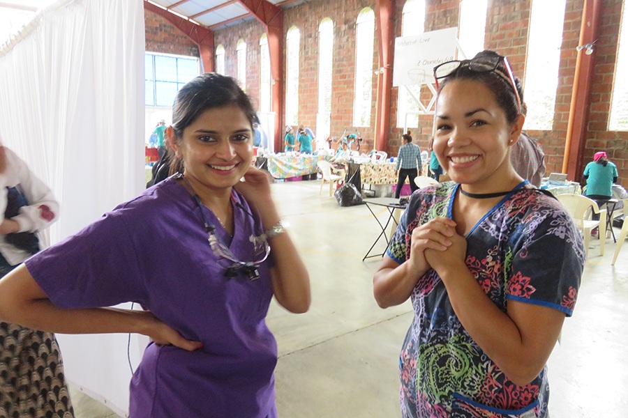 Two dental team members smiling together