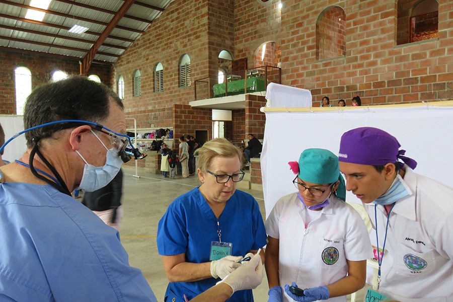 Dentists and team members discussing treatment plan