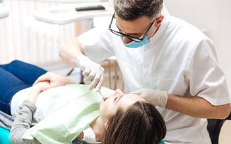 Emergency dentist in Glastonbury performing a dental exam