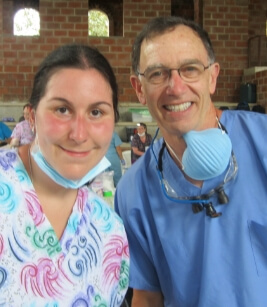 Dentist and team member at community event