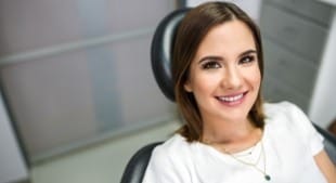 Woman smiling during preventive dentistry visit