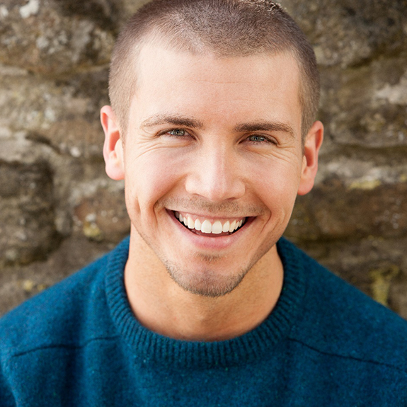 young many with veneers smiling 