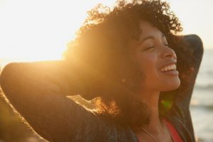 woman smiling in sunset 