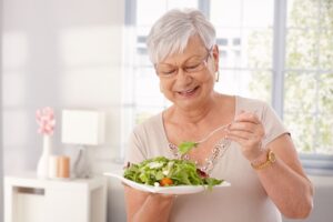 Senior woman eating a salad 